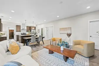 The great room looking back toward the pantry, foyer, and the oversized storage closet beyond the door on the right