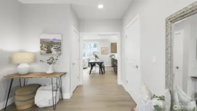 As you step into the foyer you immediately feel "at home".  High ceilings, light and bright, quality laminate extends throughout the main level.