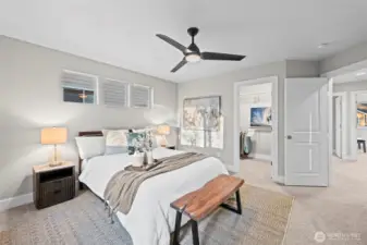 Double doors and a large walk in closet in the primary