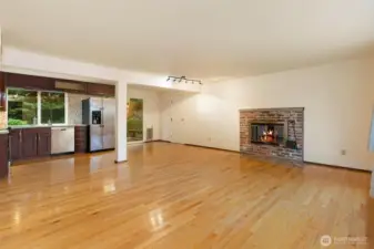 Cozy brick fireplace creates a welcoming focal point