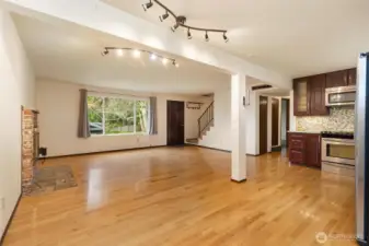 Hardwood floors flow seamlessly throughout the main living area