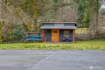 Shed for garden tools or animal feed.