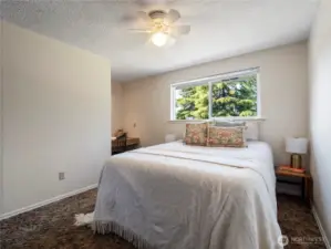 The smallest of the two bedrooms on the top floor has a built in desk.