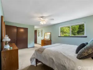 The primary bedroom has two large closets and an en suite.