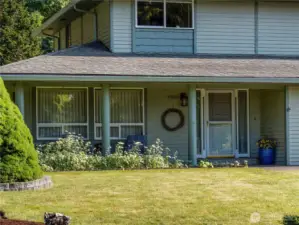 Sit on your front porch and watch the world go by. The front door has a storm door that welcomes you in.