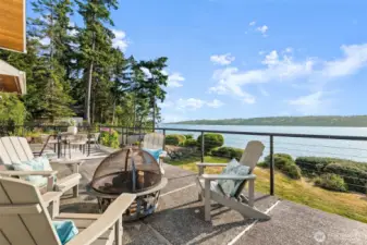 Perfect for al fresco dining or sunset watching, this outdoor space invites you to unwind and savor the beauty of the natural surroundings.