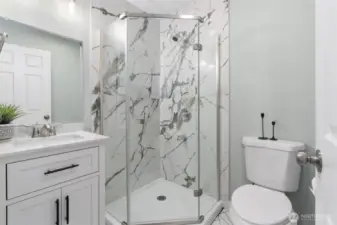 Upgraded bath with quartz countertop, new shower and flooring.