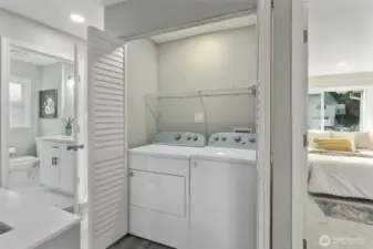 Upstairs laundry with new washer and drywer.