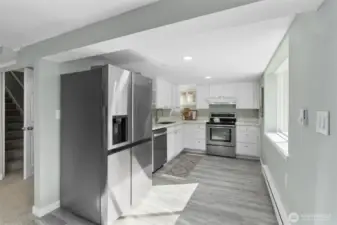 MIL Kitchen has new stainless steel appliances, new cabinets, quartz countertops.