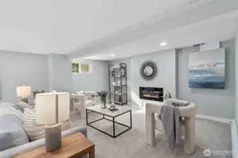 Second living room in ADU or MIL unit. Spacious with new carpeting, new fireplace, new millwork and new paint.
