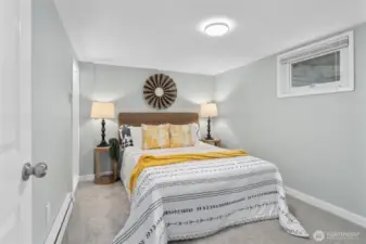 Nicely refreshed bedroom with new carpeting, millwork and paint.