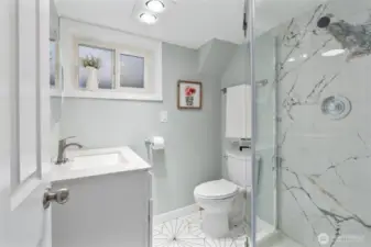Upgraded bath with quartz countertop, new shower and flooring.