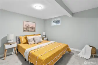 Nicely refreshed bedroom with new carpeting, millwork and paint.