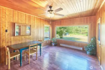 First floor, big window overlooking the back yard, door to deck and steps to back yard.