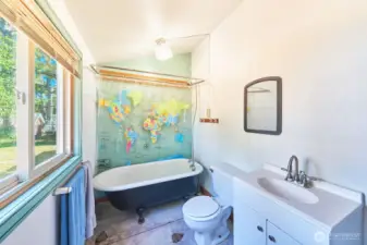 Floor needs a little love but check out that adorable clawfoot tub!