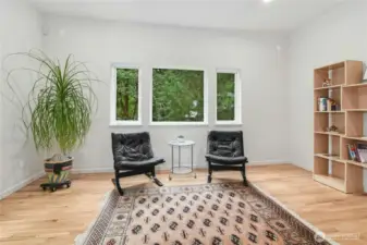 A well-appointed office with direct access to the outdoor deck.