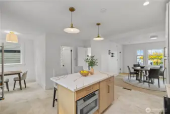 Kitchen looking at Dining Room on R, Kitchen Nook on L, Half Bath in the middle and Bedroom/Office Door