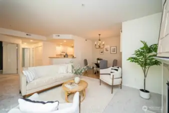 The open layout seamlessly connects the kitchen to the dining and living room, making it perfect for entertaining. The space feels spacious and inviting, with plenty of natural light streaming in.