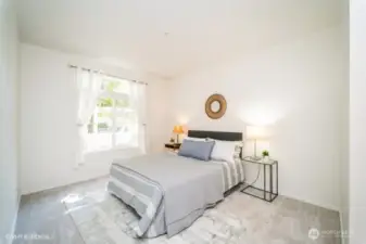 The primary suite boasts an abundance of natural light, creating a bright and airy atmosphere.