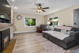 Lovely laminate floors throughout greet you as you enter the home into the living room. Updated windows bring in so much natural light.