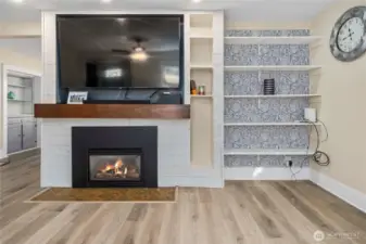 The wall-mount tv can stay with the home. Gorgeous mantel on the fireplace.