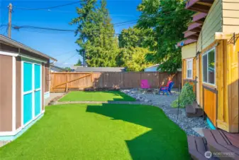 Artificial grass in the backyard as well, for low-maintenance easy living.