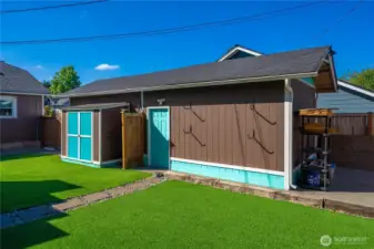 Side entrance to the detached single-car garage and there's another convenient outside storage area behind it shown on the right side.