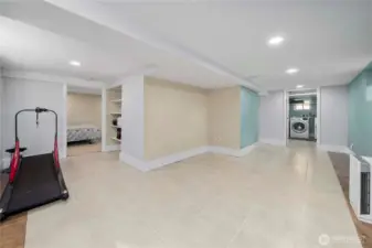 The finished basement is huge and offers a flex space shown here, as well as two bedrooms, a beautifully updated bath, and laundry room.