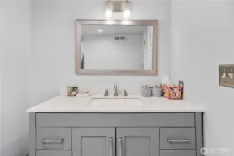 New vanity and mirror in downstairs bath.