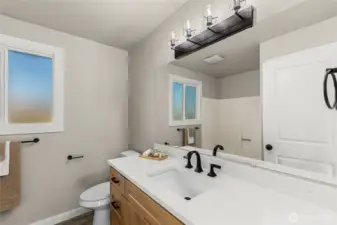 Main full bath on upper level.