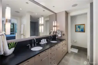 Long double vanity with plenty of room for two and storage. Private Water Closet