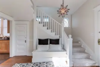 Perfect place to put on or take off shoes. Door leads to unfinished basement, laundry area and garage access.