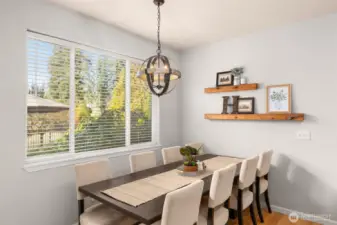 This informal dining space has an updated light and a great view of the backyard.
