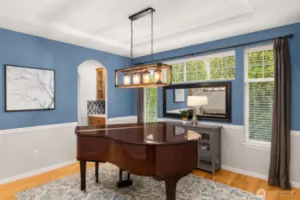 This dining room has a tray ceiling, wainscoting, and plenty of windows. Conveniently located just past the Butler's Pantry.