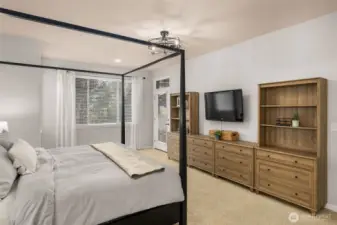 This door leads to the backyard from the primary suite.