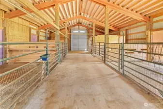 Huge barn with electricity and water. 4 stalls with exterior doors. Lots of room for horses, goats etc. Oversized roll p door for tractor and/or toy storage.