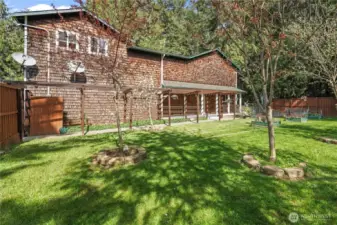 Fully Fenced & Level Yard w/ a variety of fruit trees, flora & fauna