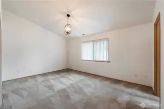 Primary bedroom upstairs vaulted ceiling.