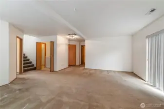 Downstairs boasts 2 bedrooms, family room, laundry with storage, half bath and garage access.