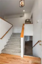 Open and airy front entry with beautiful hardwood floors