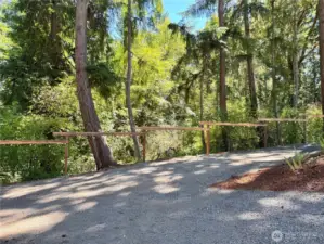 Lighted fencing lines the driveway.