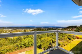 Views from the deck off the primary suite. Glass slat railing