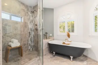 Tub and separate tiled shower.