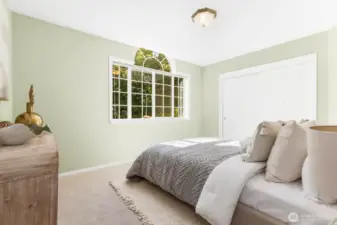 Third bedroom with beautiful windows and new carpeting.