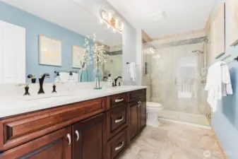 Main bath upstairs with double vanity, beautiful tile. Soft close drawers and pull out drawers under the sink are a nice touch.