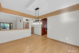 Dining room with stained soffit & located next to kitchen.