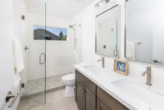 Primary bathroom with heated floors, dual vanities and expansive walk in shower!