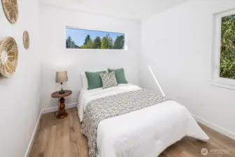 Second top floor bedroom shown here with a queen size bed.  Lots of space for office or study or extra bedroom as shown.