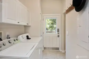 On the other side of the kitchen is an entrance and small deck. Your back is to the half bath.