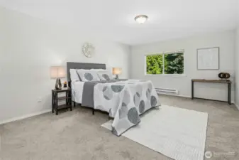 Spacious Primary Bedroom looking out to green.